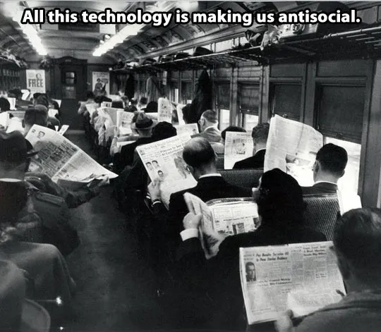 People ignoring each other, too busy looking at their newspapers.